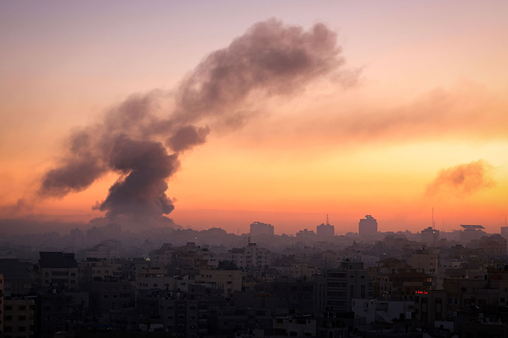 Fire and smoke rise above buildings in Gaza City.