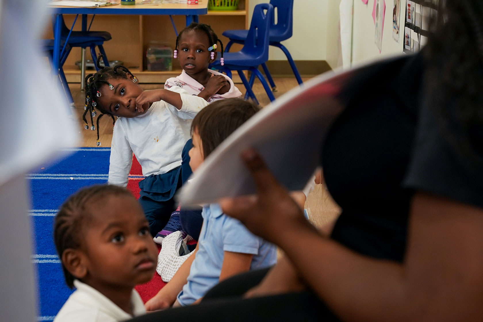 A teacher leads a preschool class at an early learning public charter school in Washington, D.C.