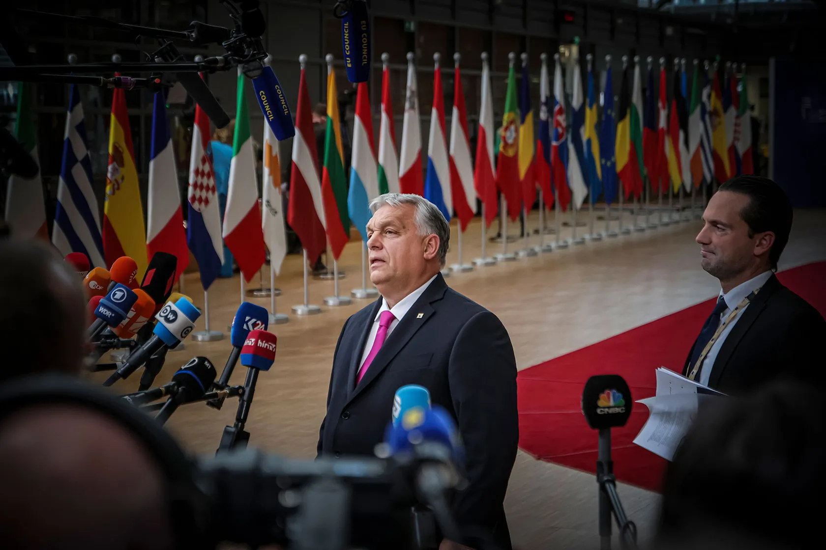 Hungarian Prime Minister Viktor Orbán gives a statement to the media after arriving at the European Council.