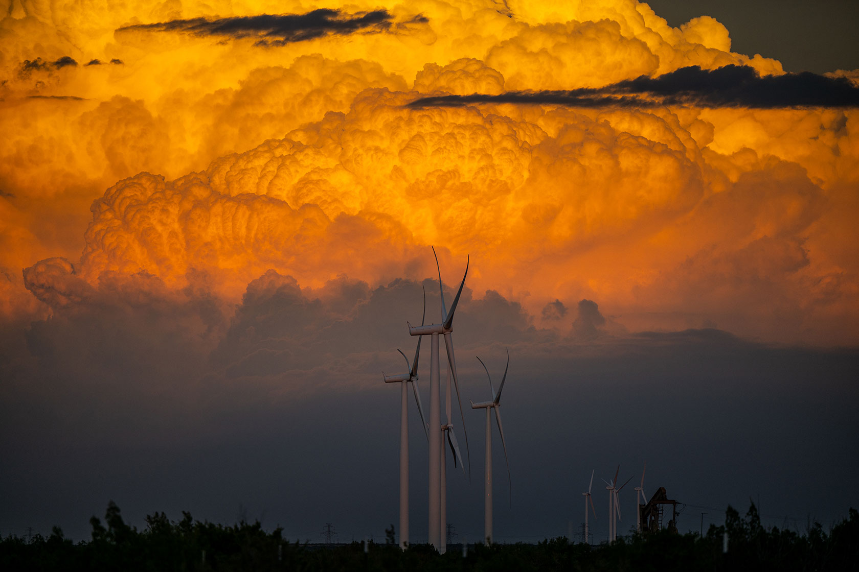 Clouds rise behind wind turbines in Big Spring, Texas.