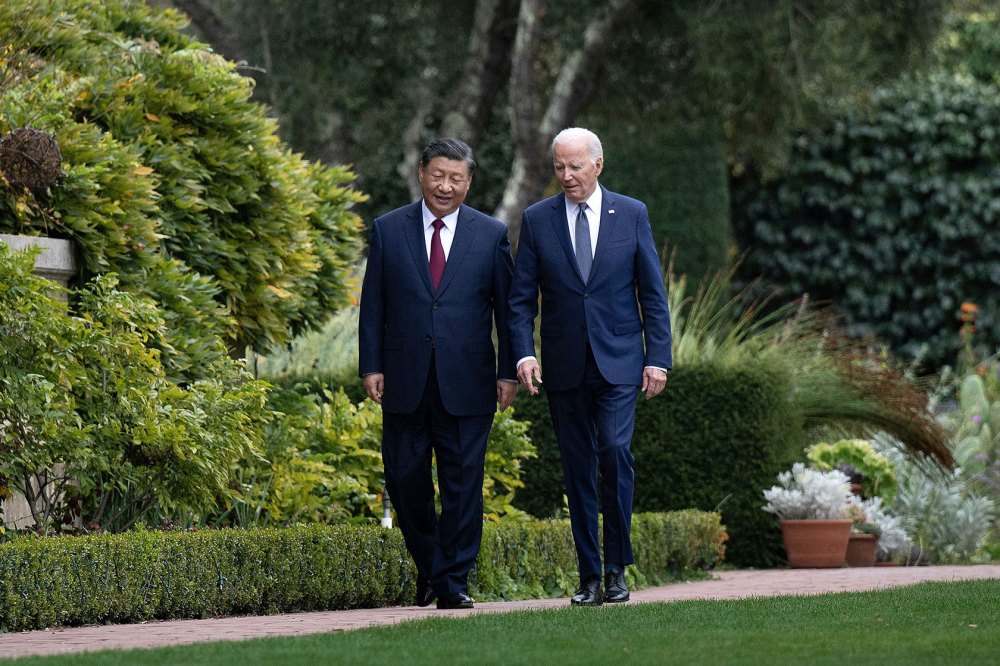 Photo shows Joe Biden and Xi Jinping walking side by side in a garden