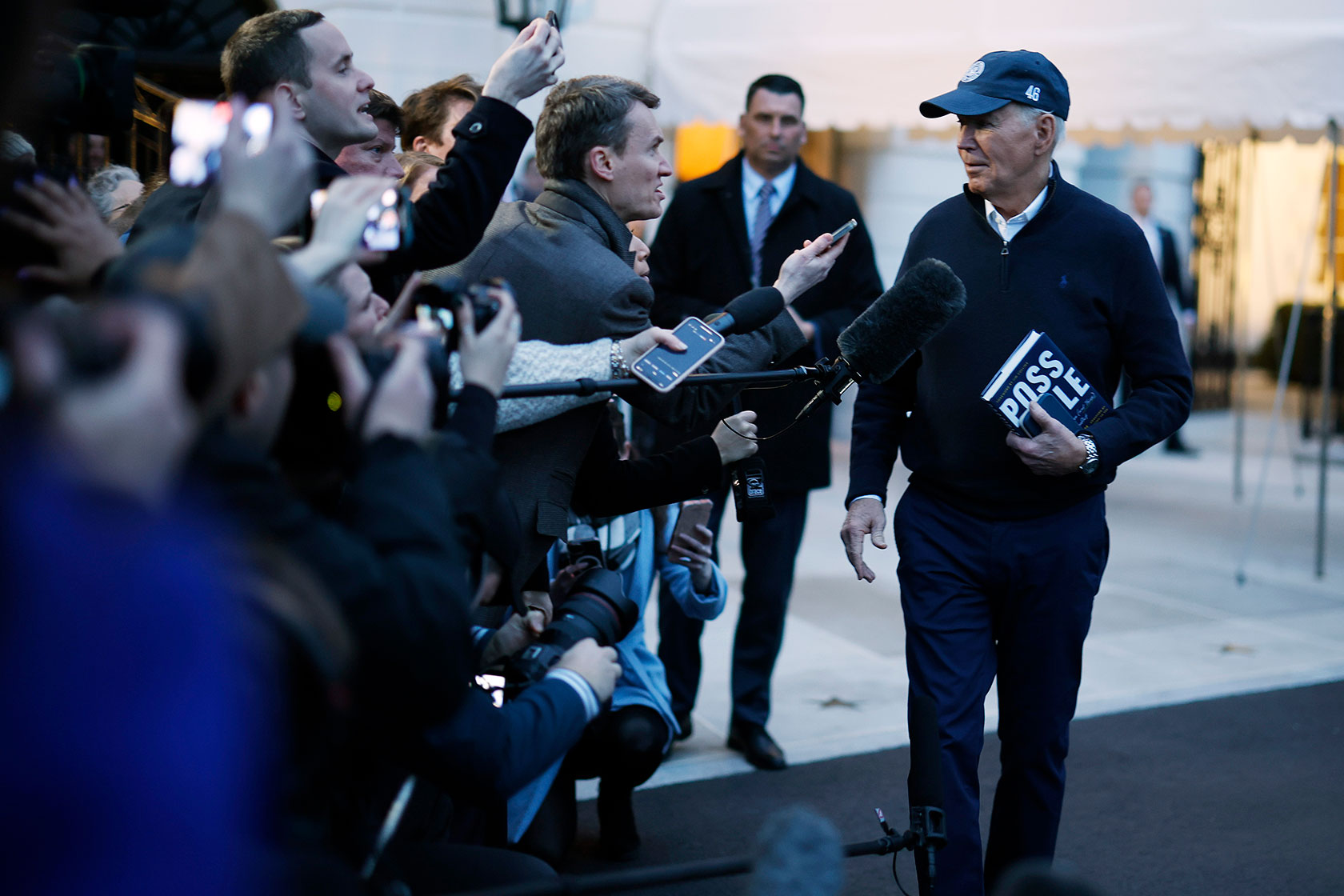 U.S. President Joe Biden stops to talk to reporters as he departs the White House.