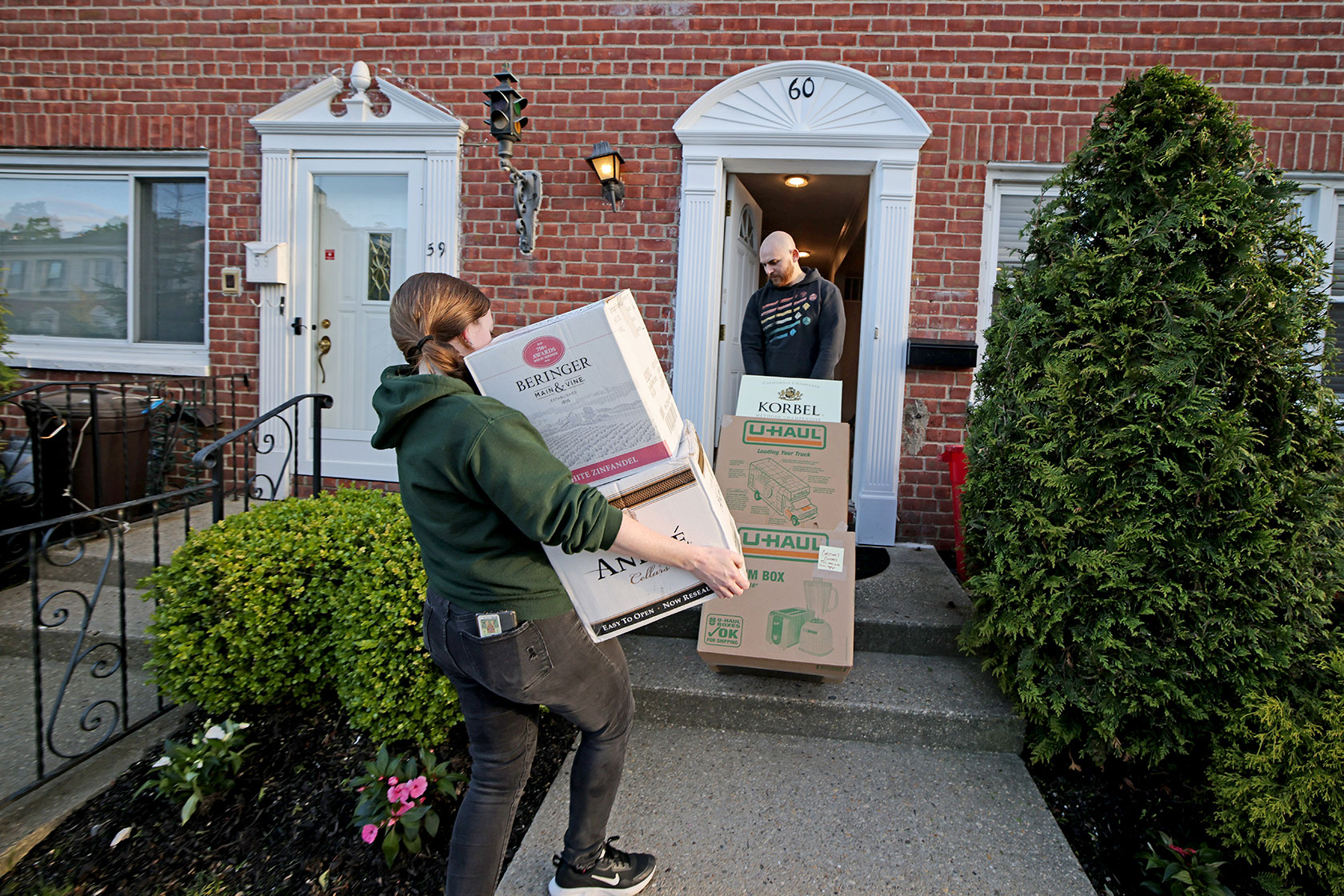 Recent homebuyers move into their new condo.