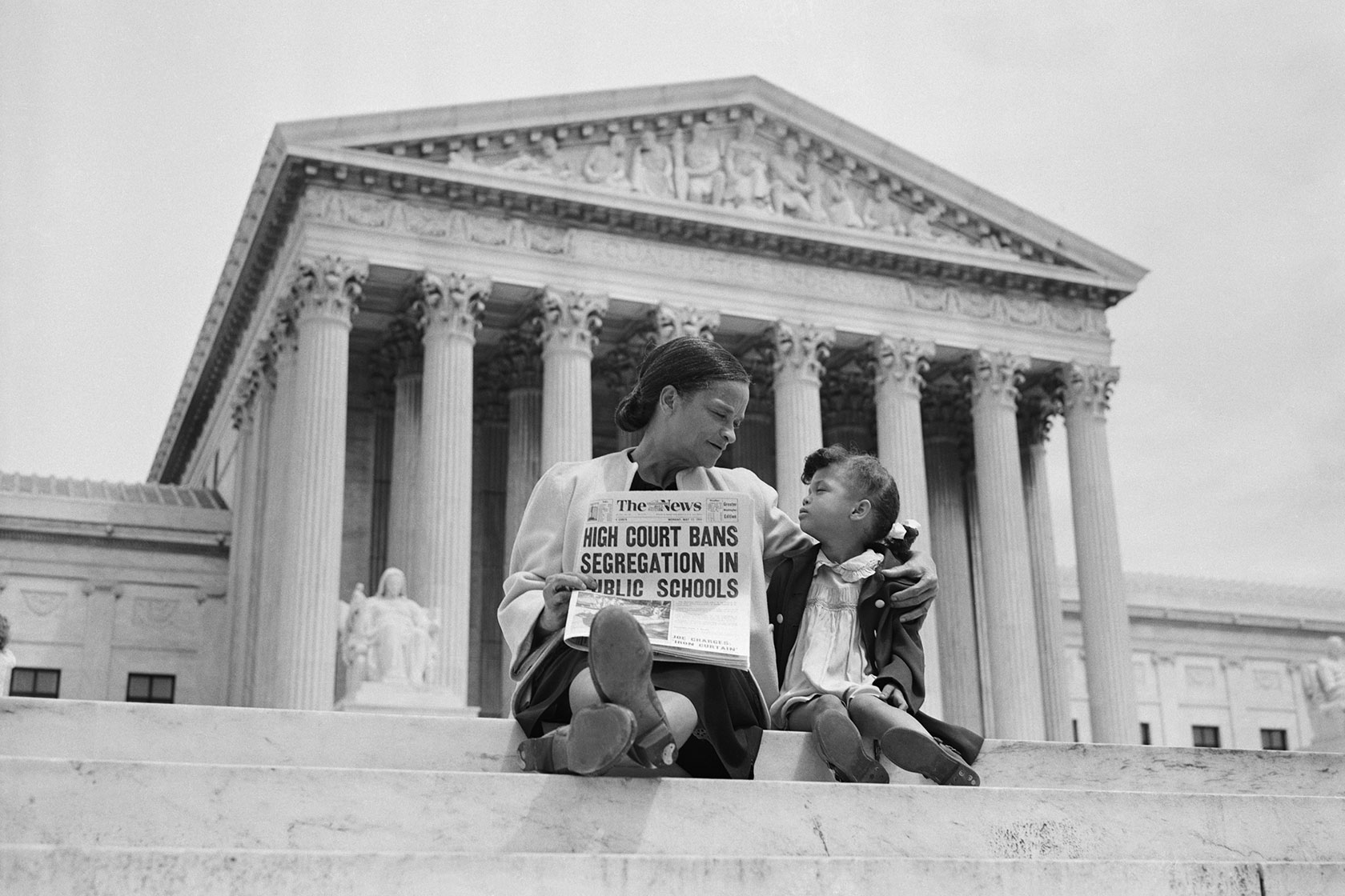 Nettie Hunt and her daughter, Nickie, sit on the steps of the U.S. Supreme Court.