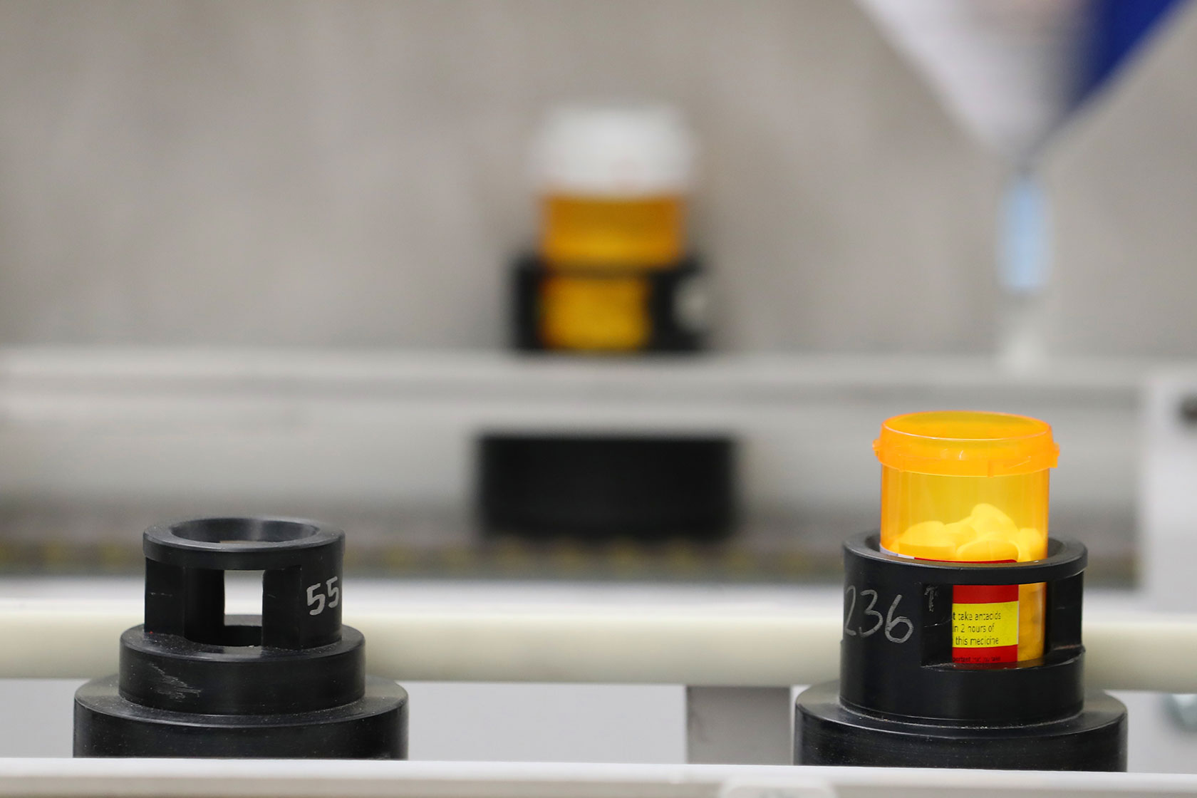 Bottles of prescription drugs on automated line