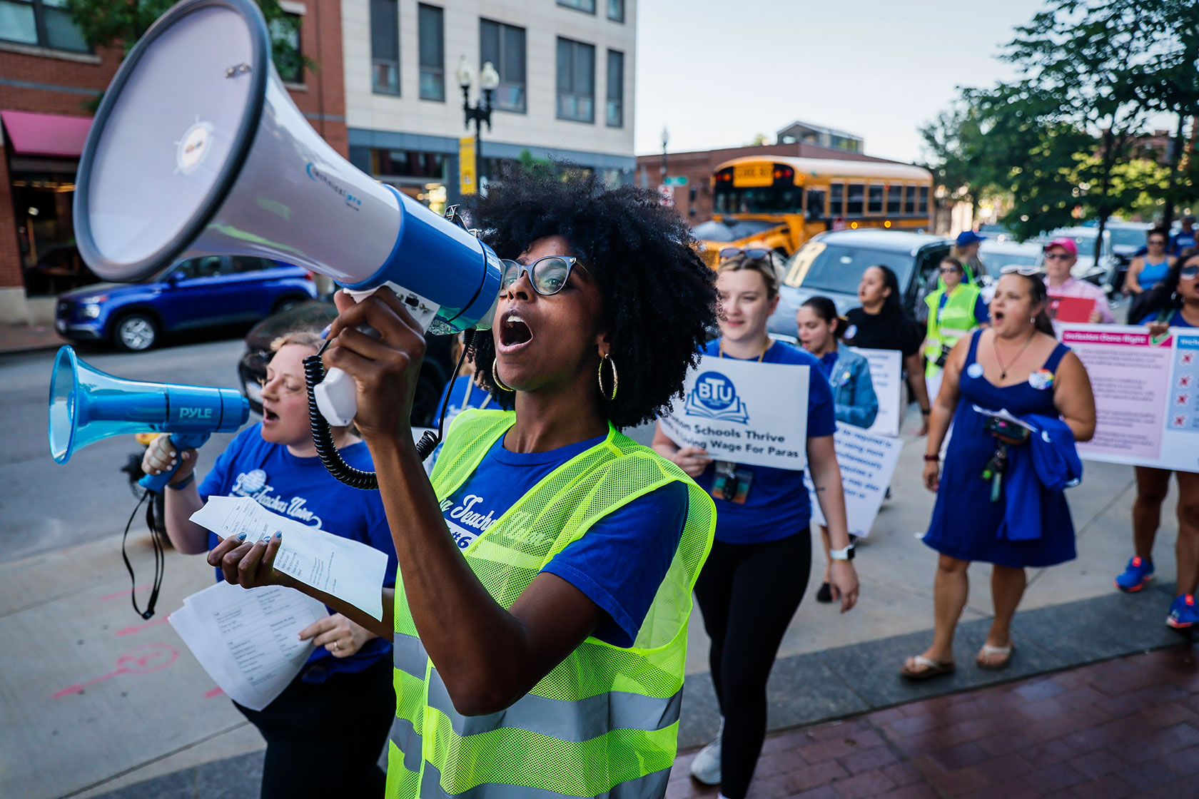 Members of the Boston Teachers Union and their supporters rally in support of contract measures.