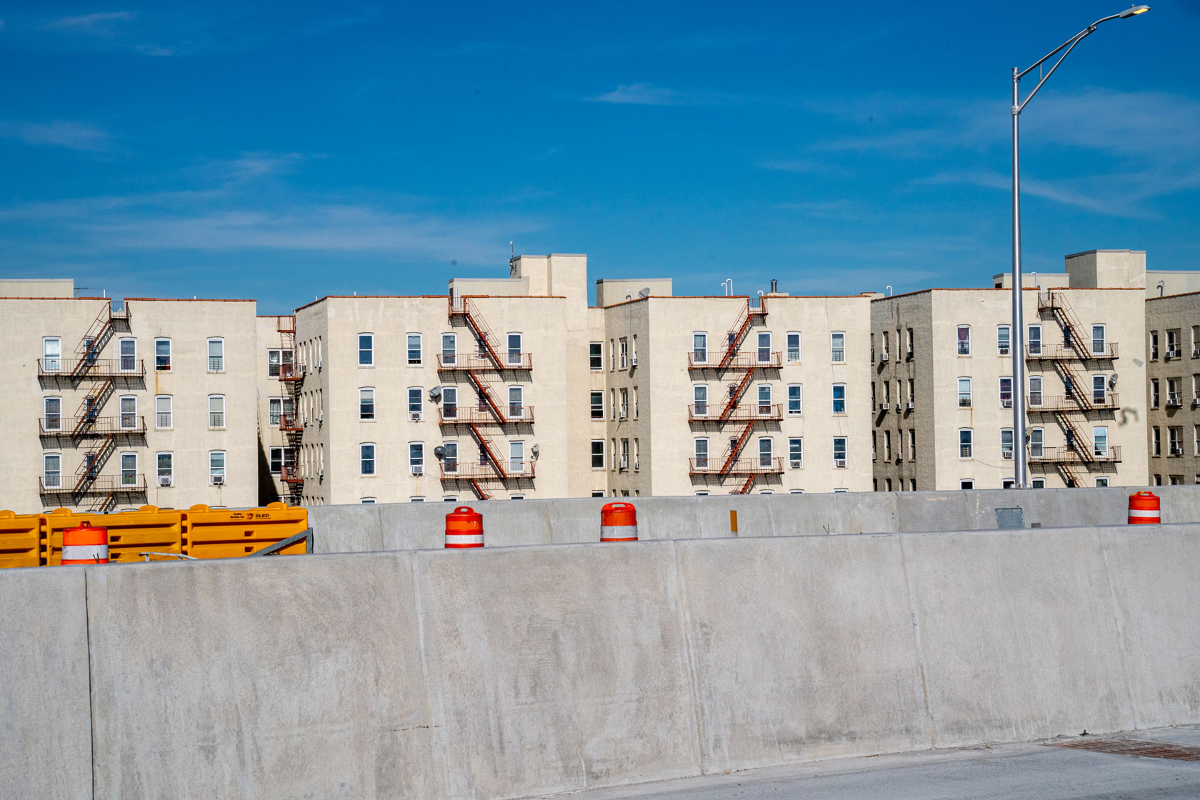 Roadwork is seen being done in front of a low-income housing project in the Bronx borough of New York City on October 30, 2022.