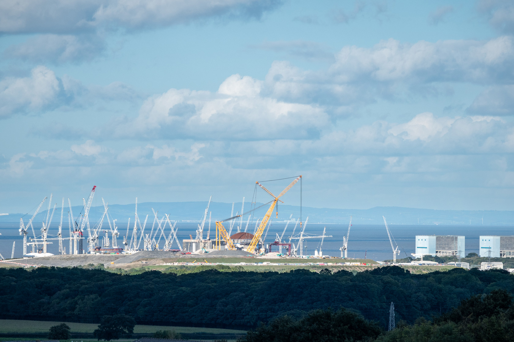 Cranes surround the Hinkley Point C nuclear power station in Somerset, England.