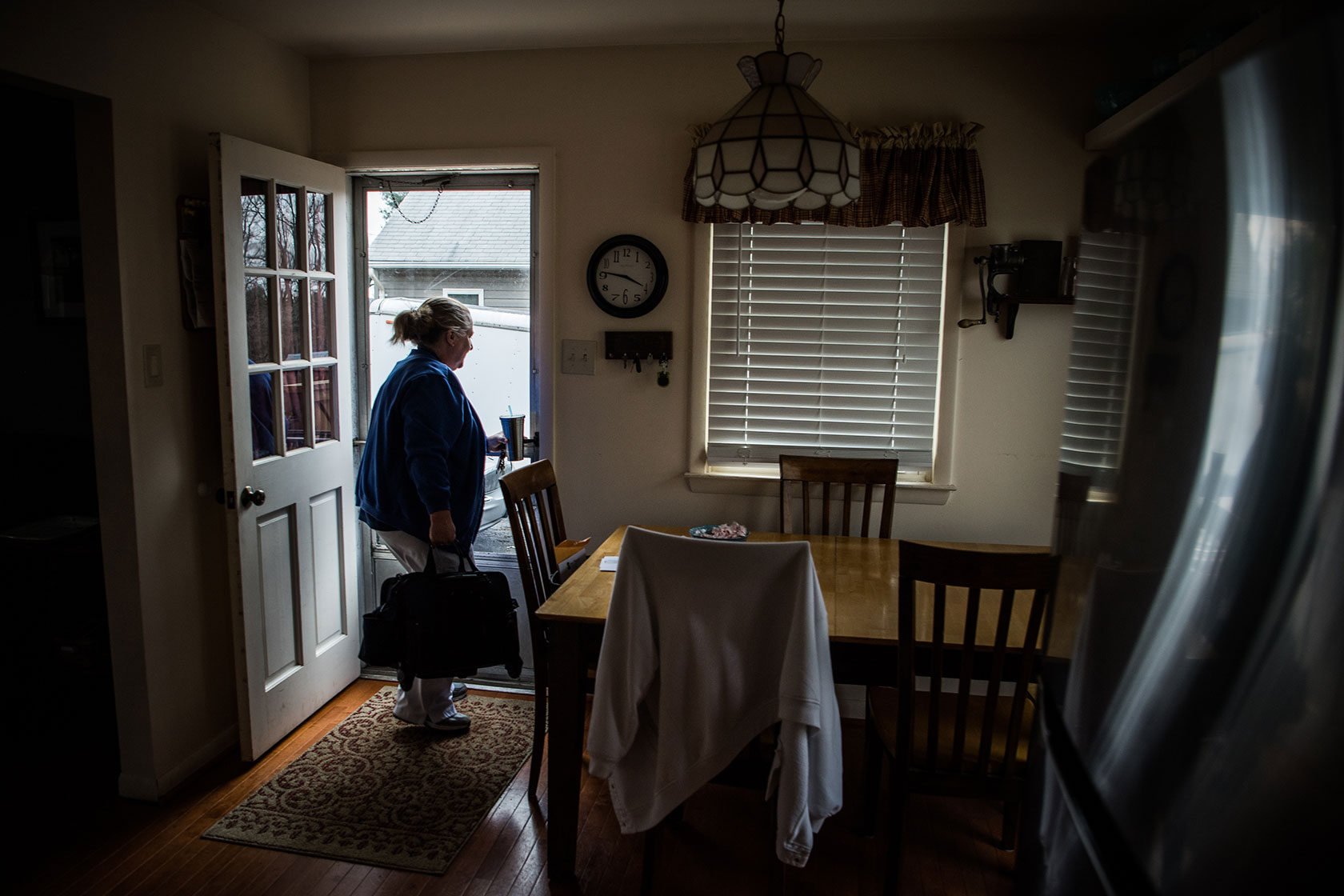 A woman about to open her front door