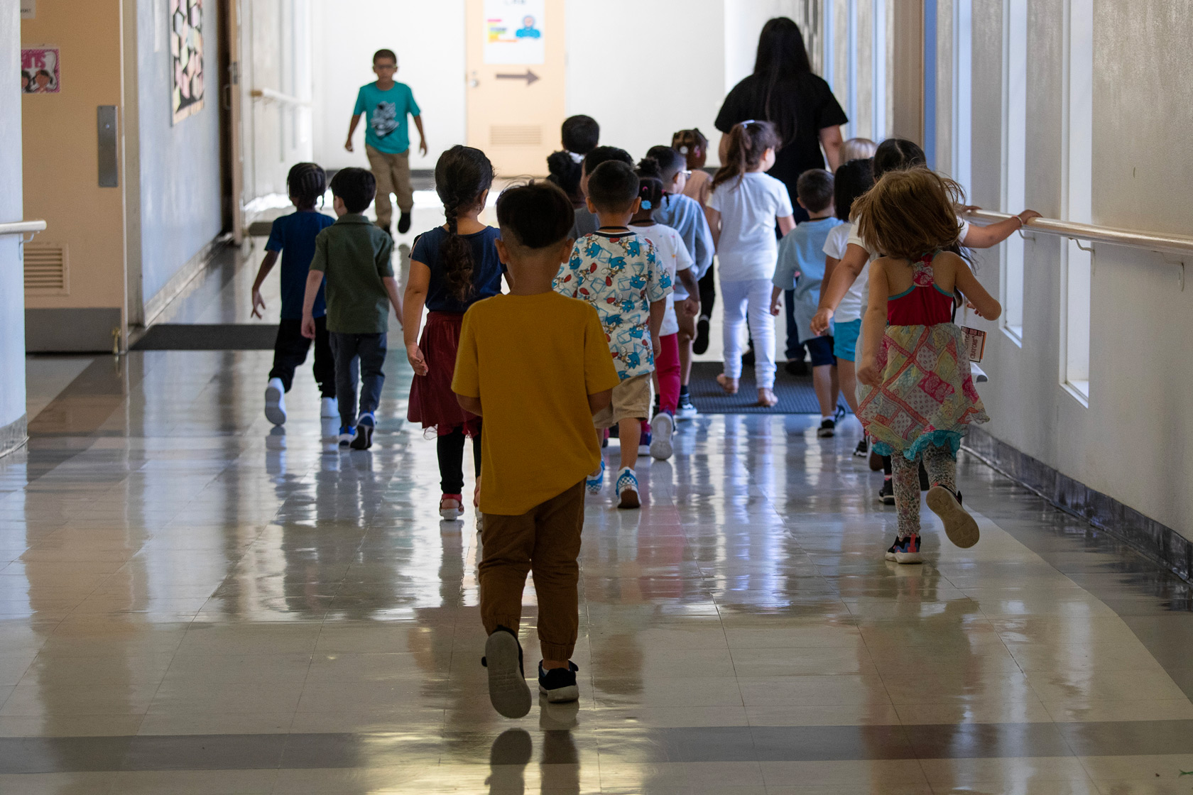 A transitional kindergarten class walks down the hall at Germain Academy for Academic Achievement in Chatsworth, CA.