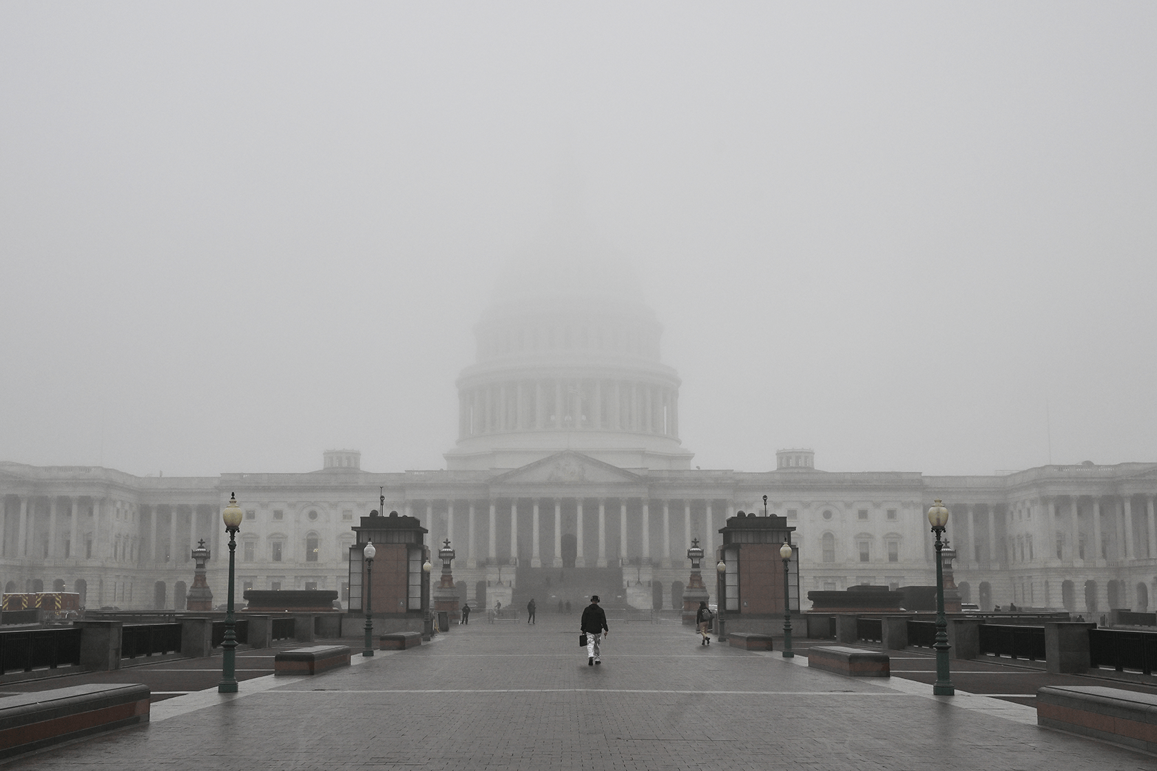 The U.S. Capitol building is seen on a foggy morning.