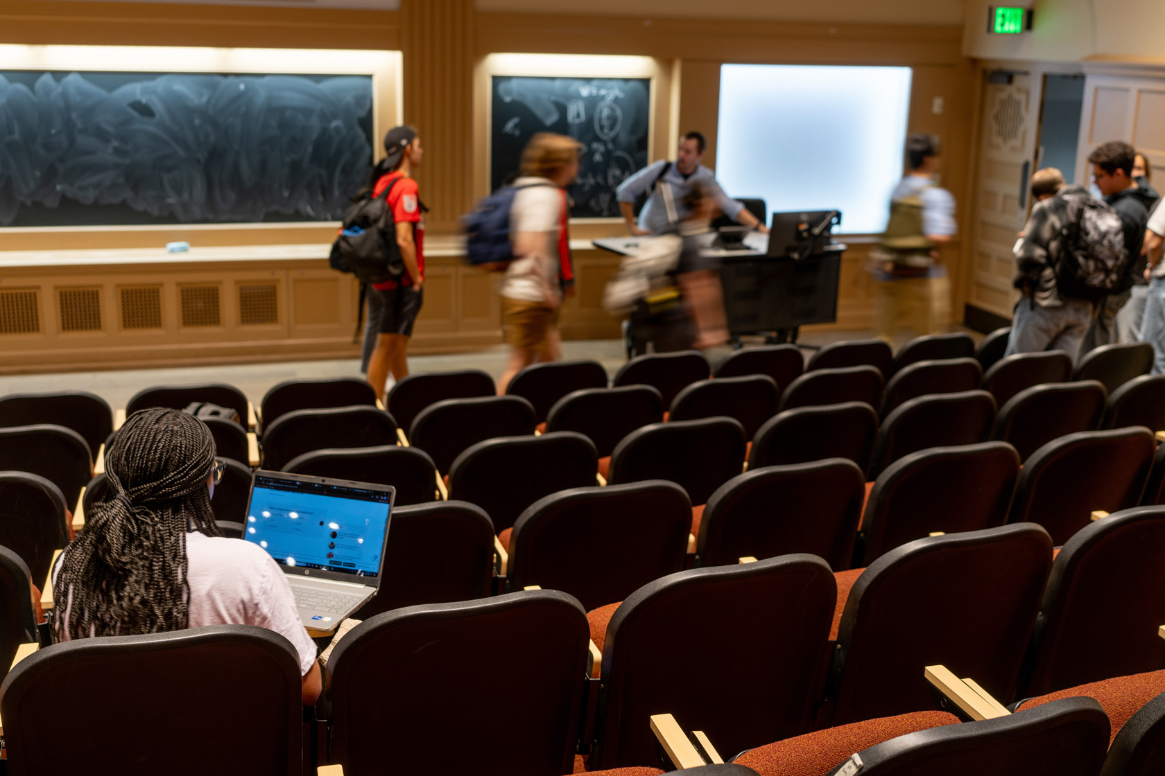 A student sits in a college lecture hall at the University of Texas at Austin, February 22, 2024.