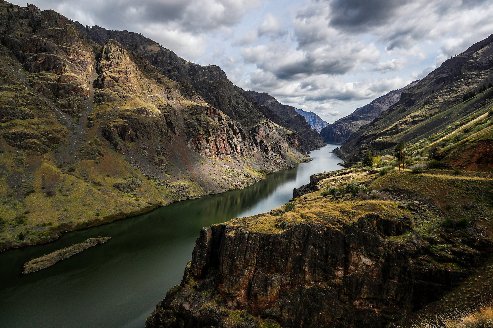 The Snake River courses through steep buttes heading toward Hells Canyon Dam.