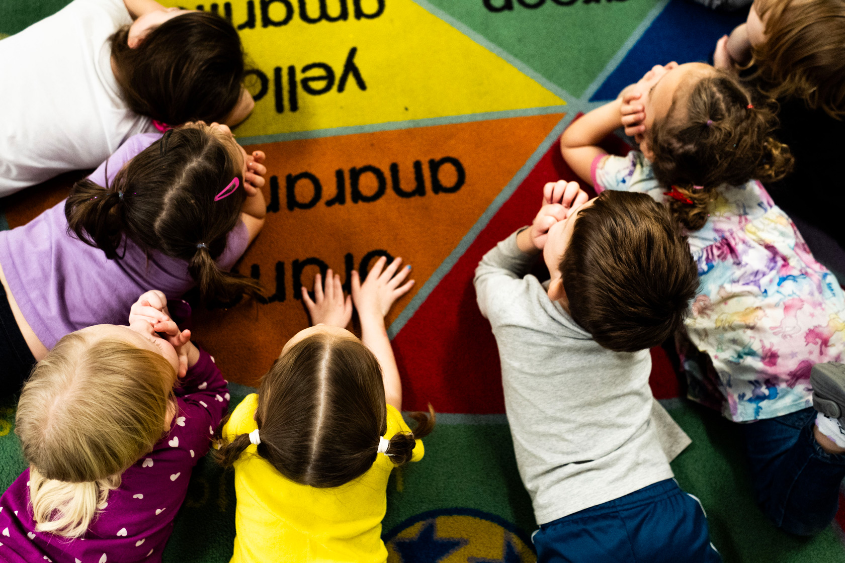 Children sit on the rug at the TLC for Tots daycare center in Nampa, Idaho, November 20, 2024.