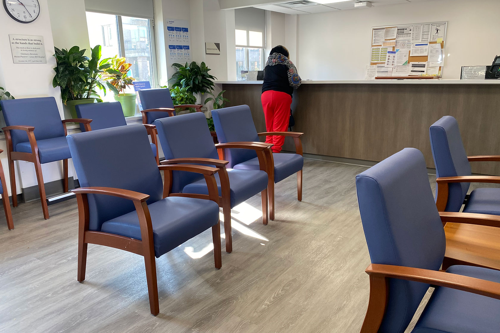 Woman standing at reception desk