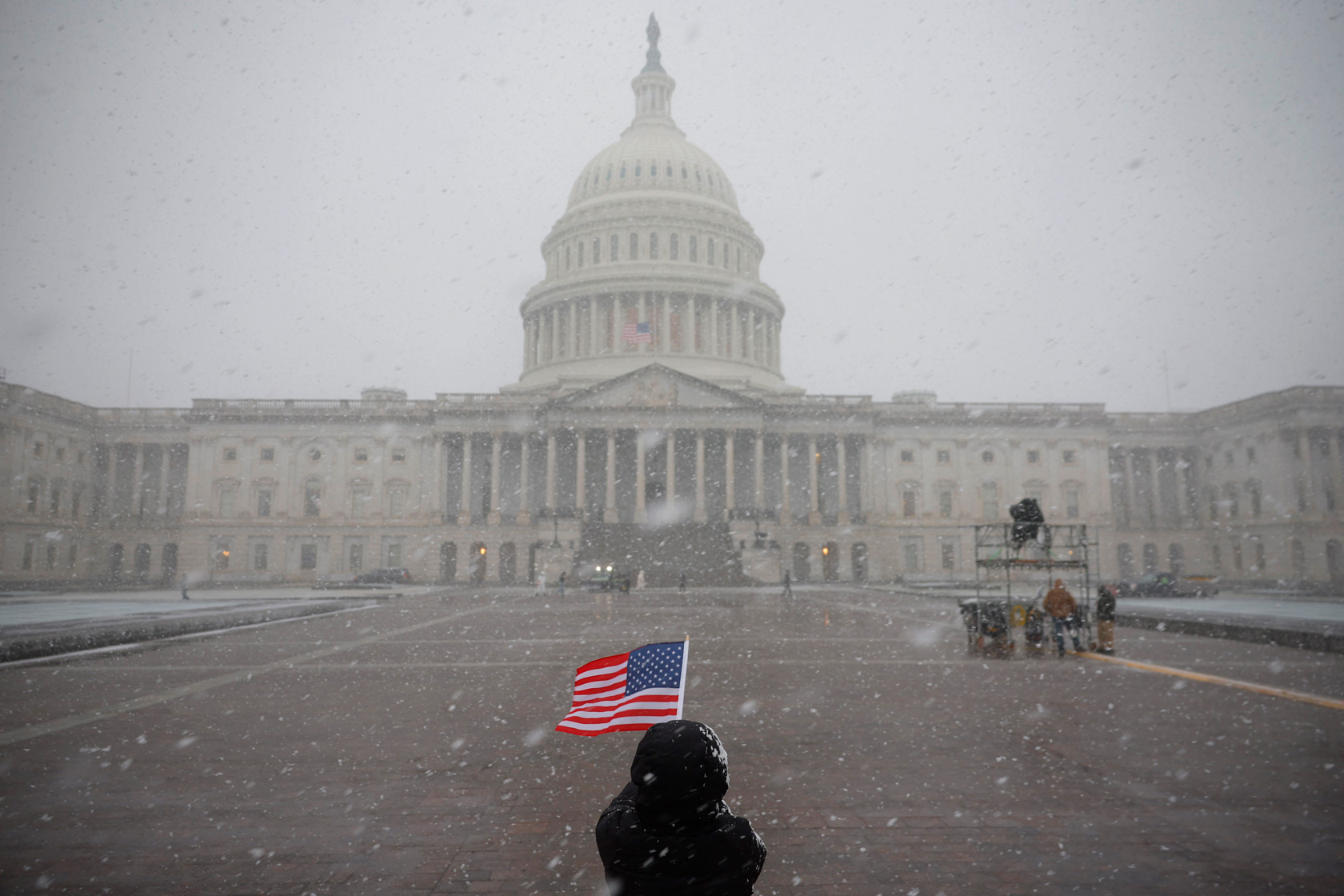 An American flag is visible in front of the U.S. Capitol Building in Washington, D.C., January 19, 2025.
