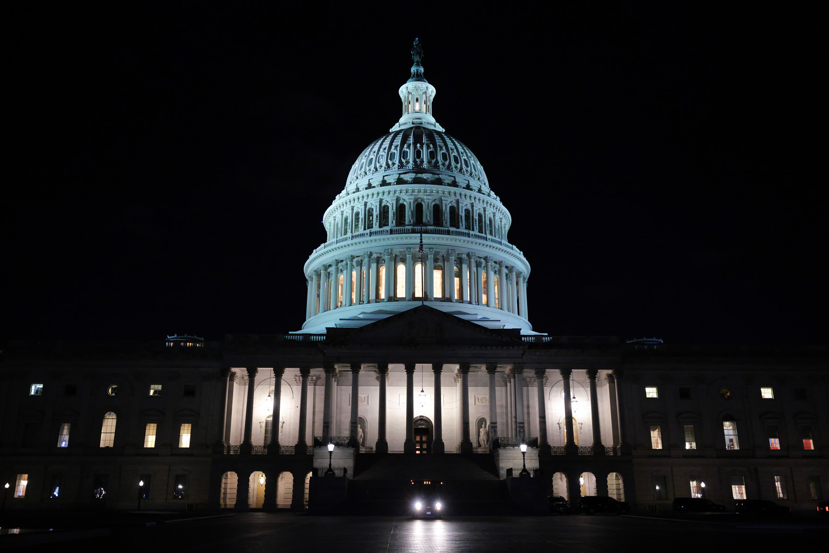 The U.S. Capitol dome is illuminated.