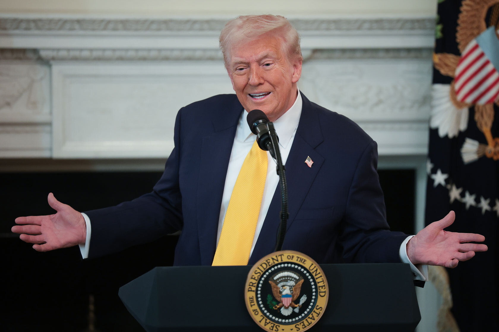 President Donald Trump addresses a meeting.