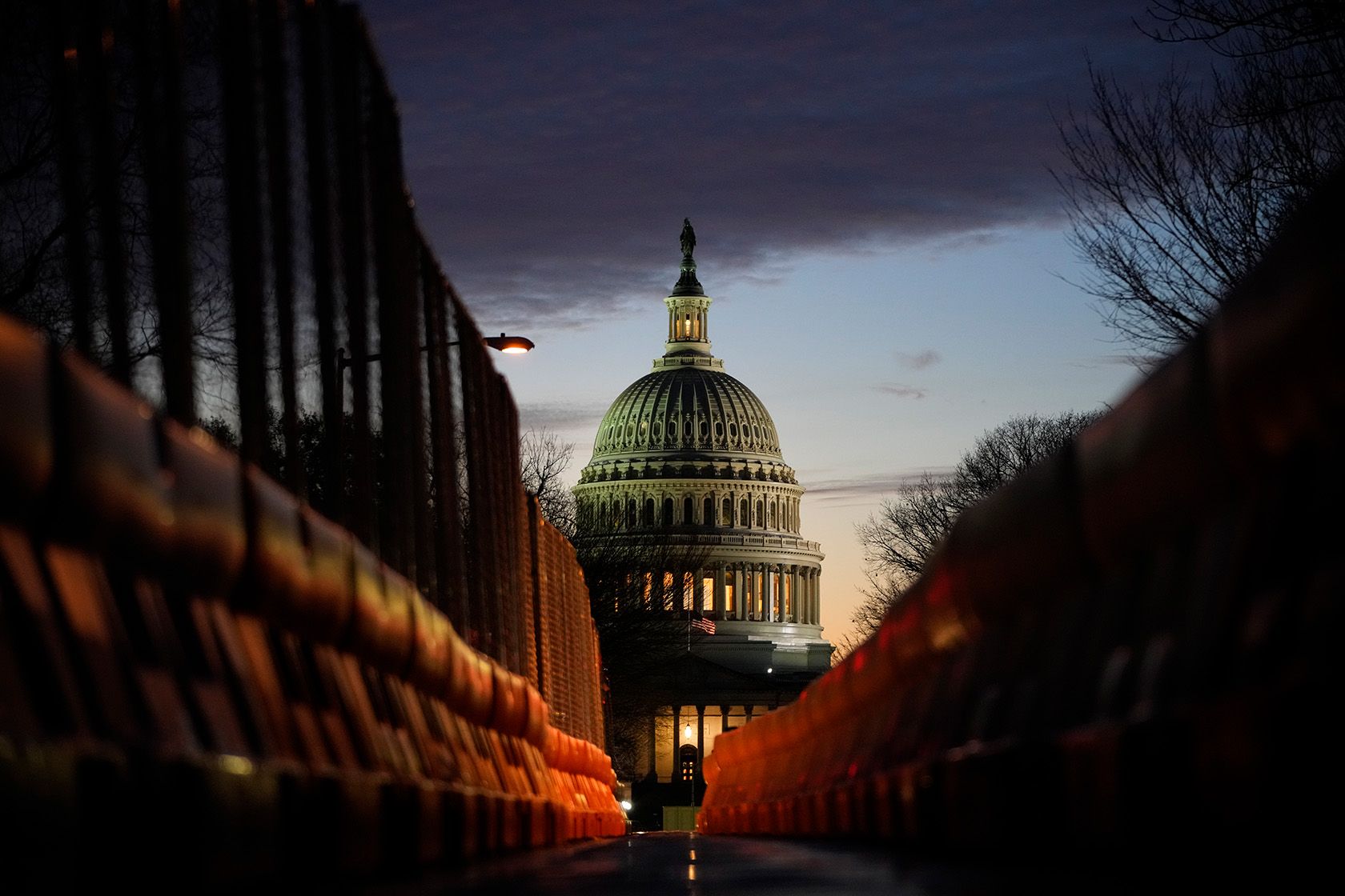 The U.S. Capitol is seen from East Capitol Street at sunset.