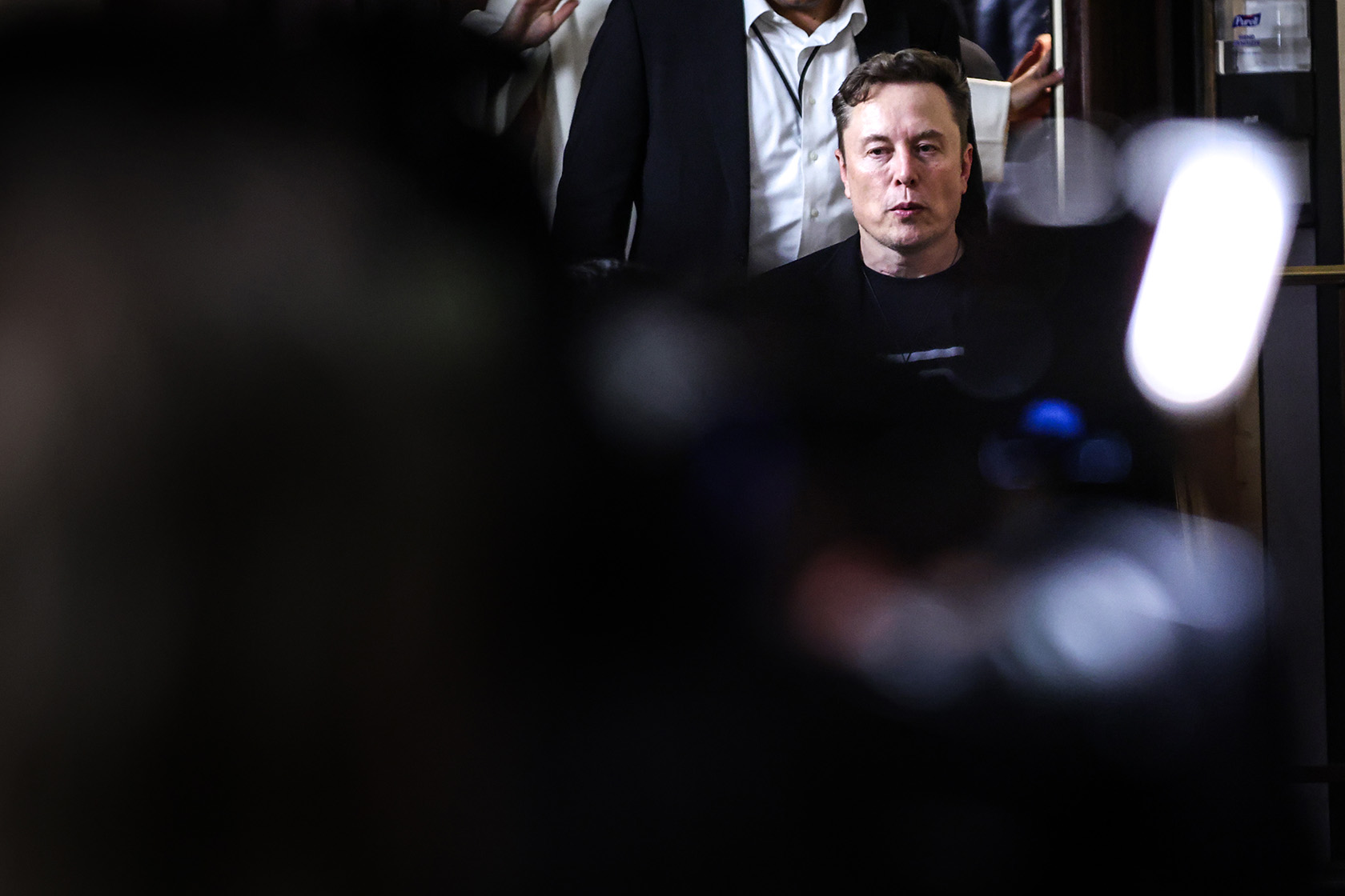 Elon Musk leaves a meeting with House Republicans in the basement of the U.S. Capitol building.