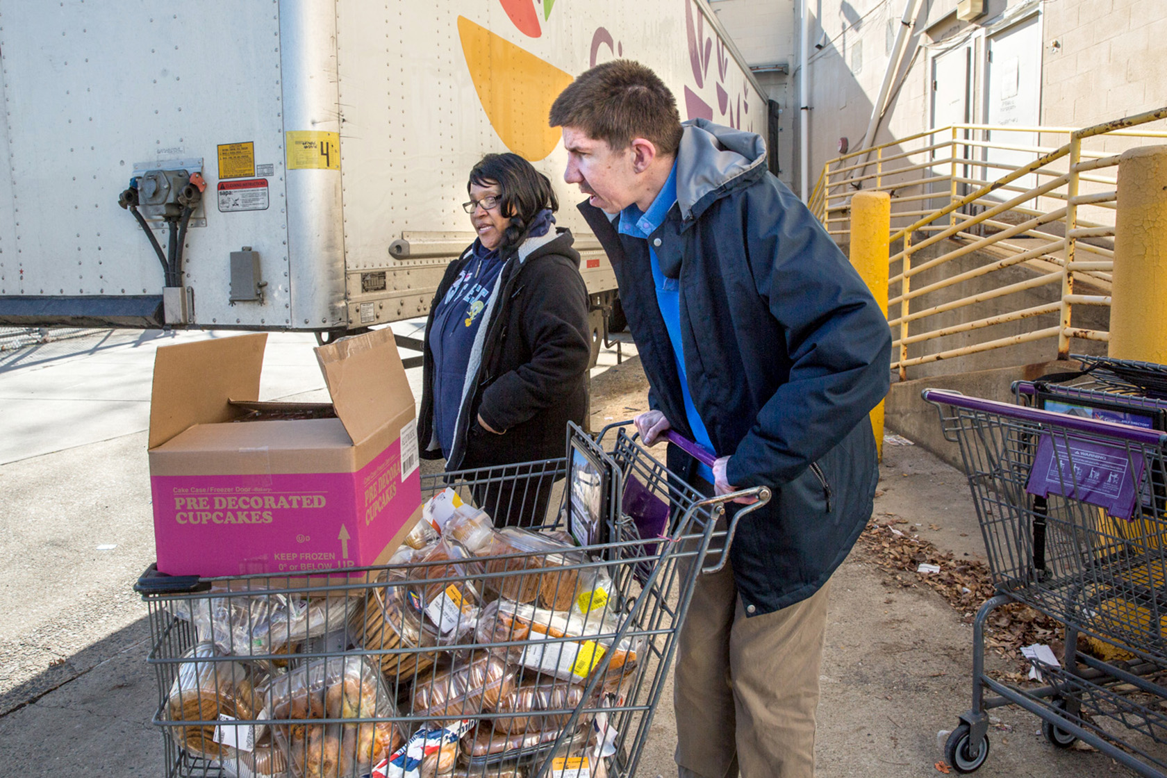 A man with cerebral palsy collects donated food from a Giant in Annandale, Virginia.
