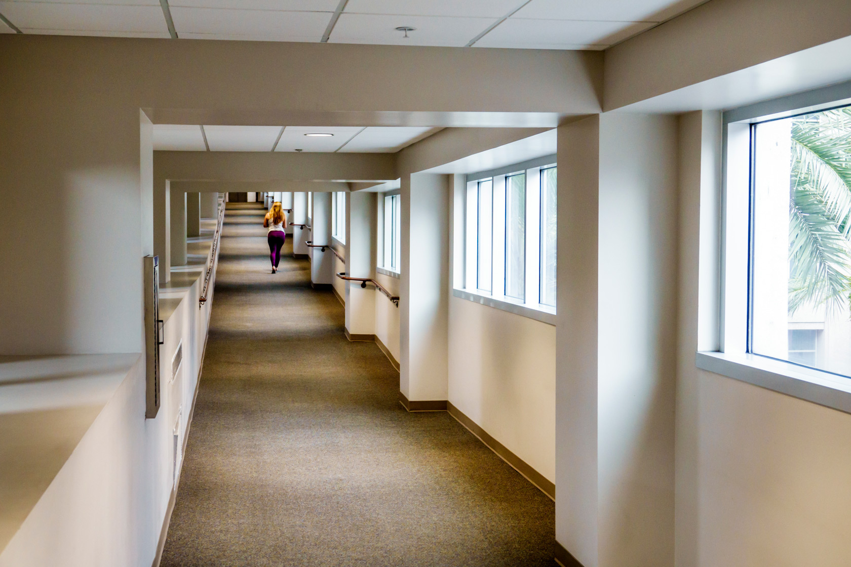 A woman walks down a hallway in Orlando, Florida.