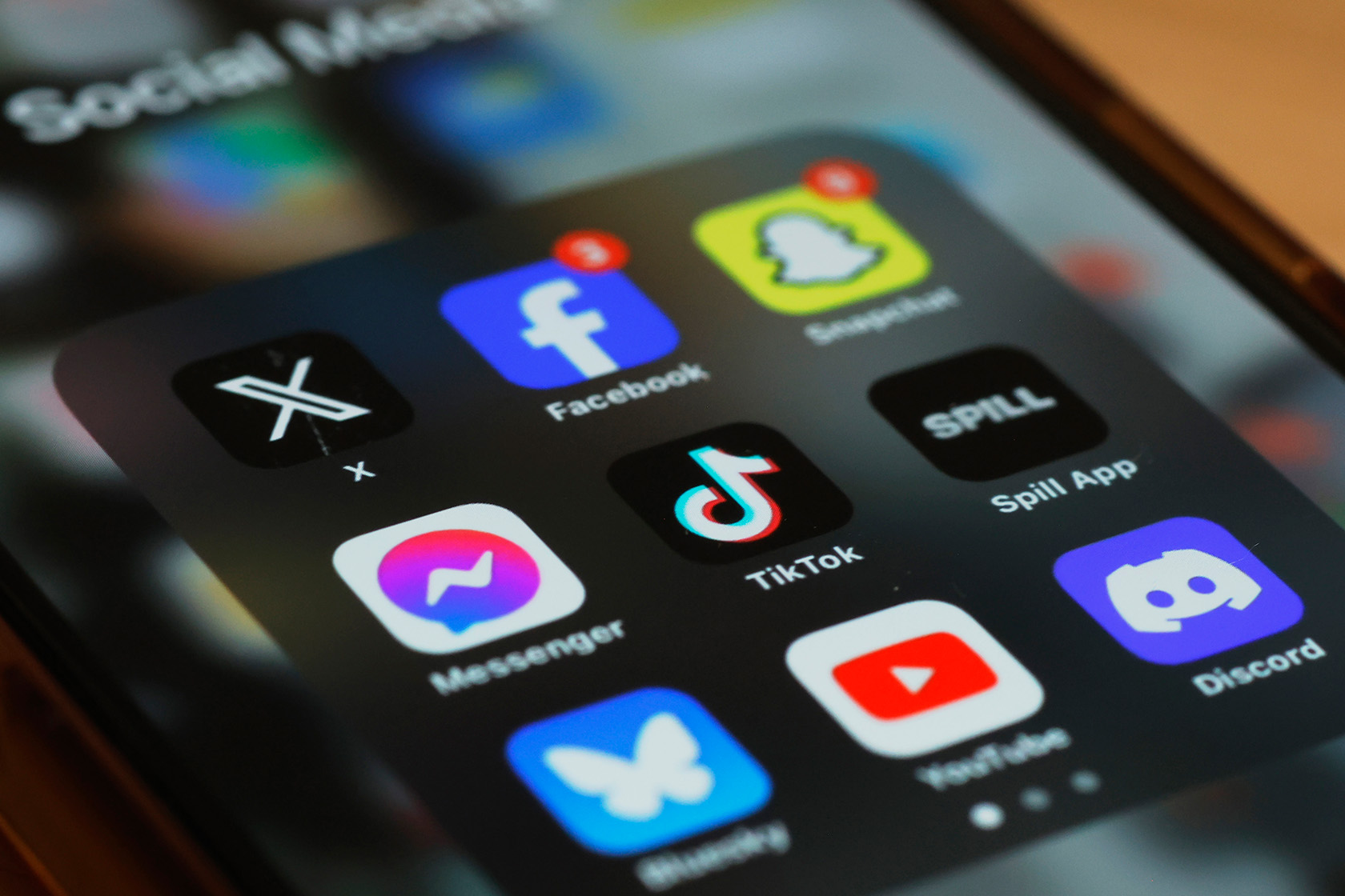 Social media apps are displayed on a smartphone.