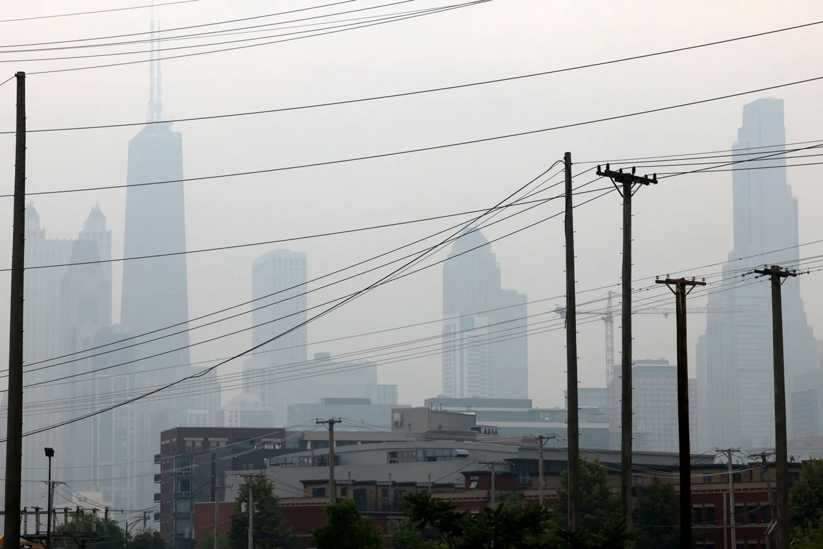 Power lines are seen in front of the Chicago, Illinois, skyline.