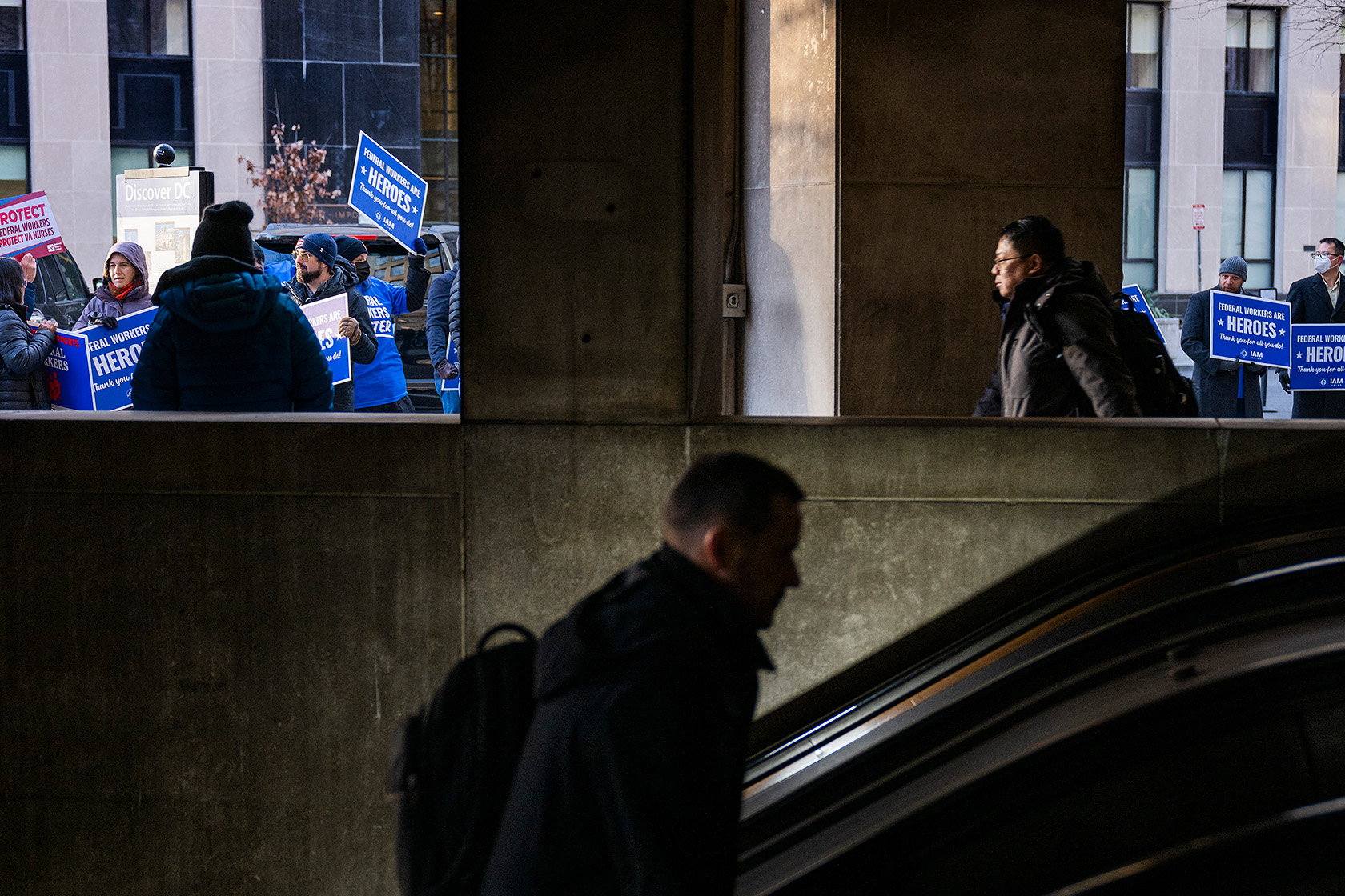 Commuters exit McPherson Square Metro station.