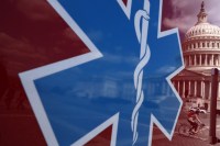 The U.S. Capitol is reflected on the side of an ambulance.