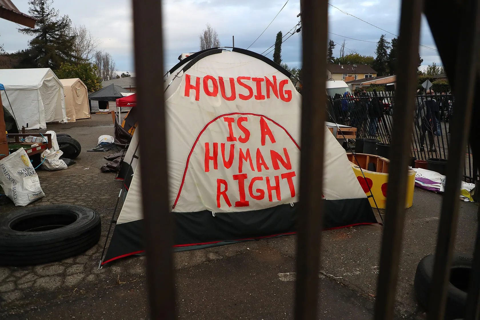 Tent painted with the words Housing is a human right