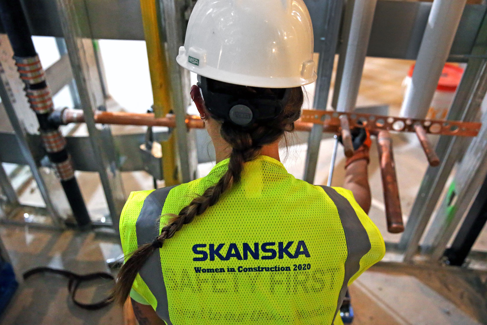 A female construction worker is seen at work.