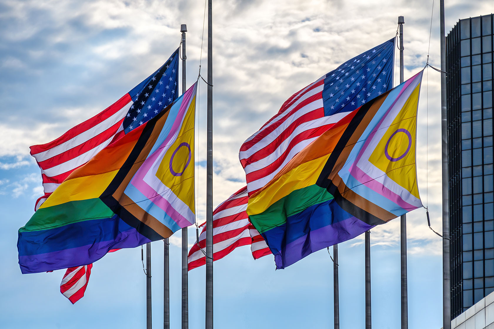 American flags behind intersex-inclusive Pride flags