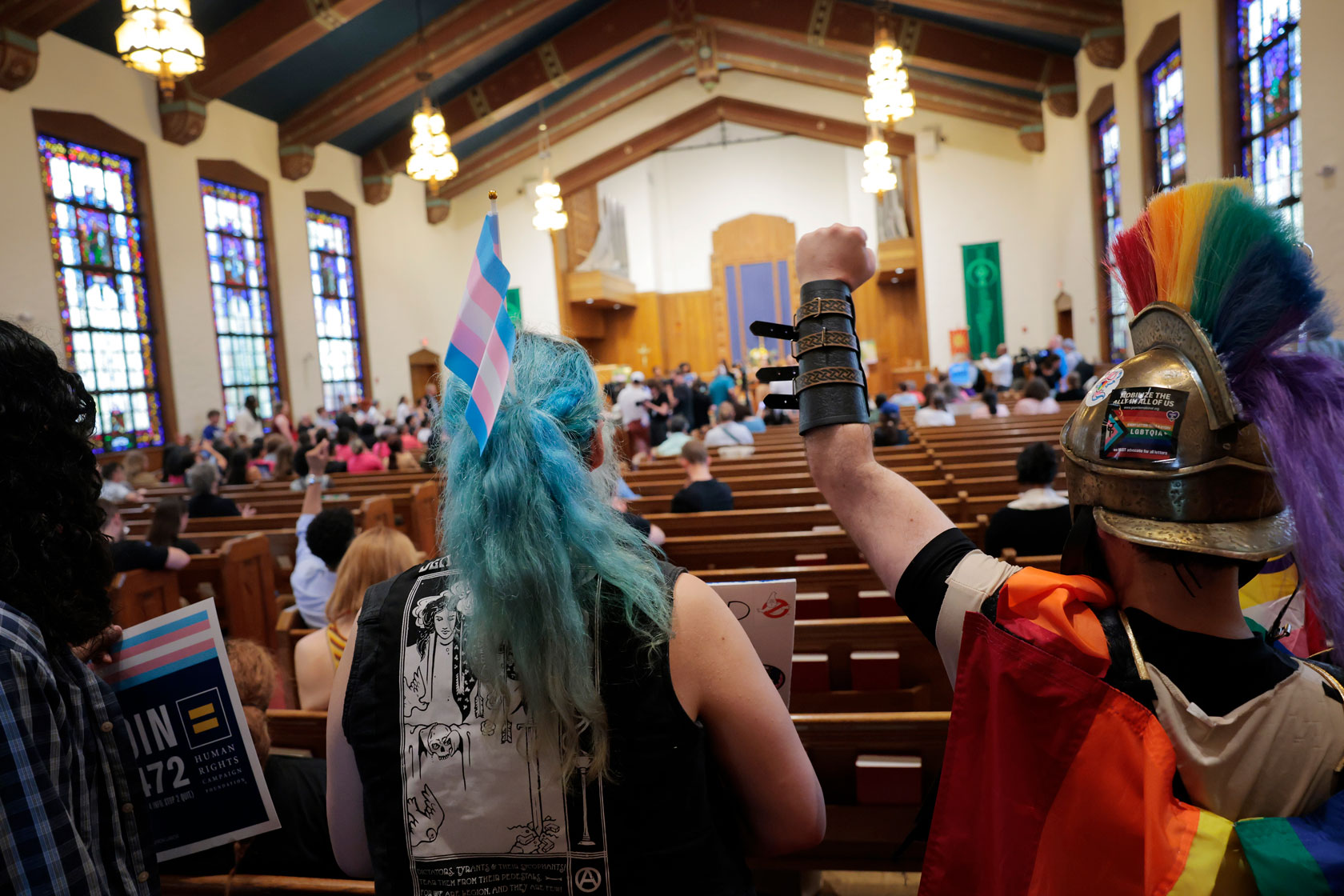 Activists attend a rally in support of health care for transgender youth.
