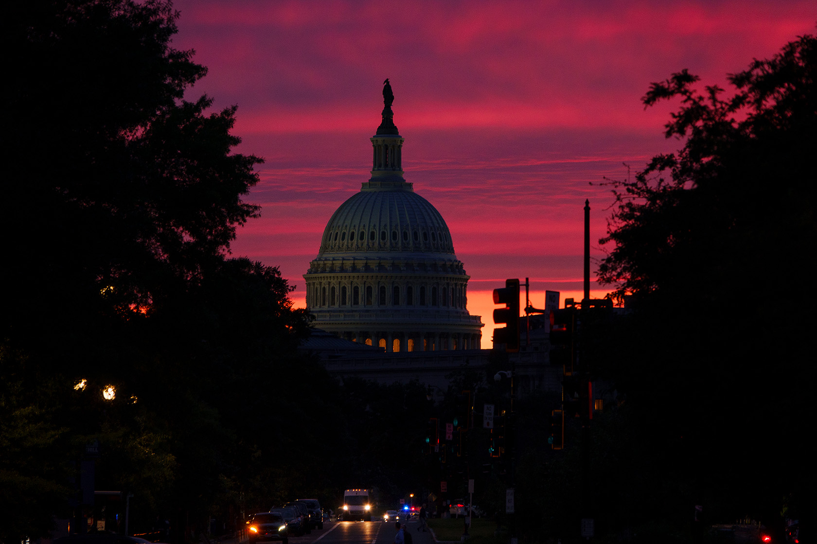 The sun sets behind the U.S. Capitol.