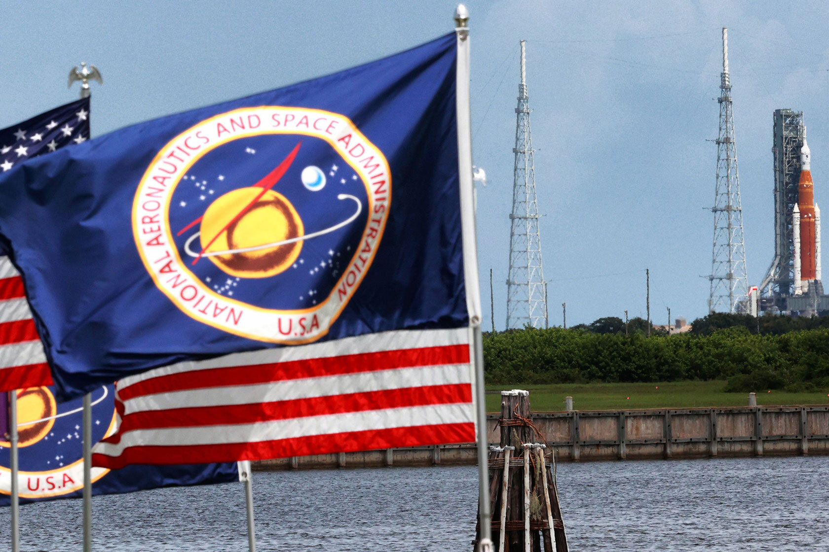 With flags flapping in the breeze, Artemis I sits at pad 39-B at Kennedy Space Center, Florida.