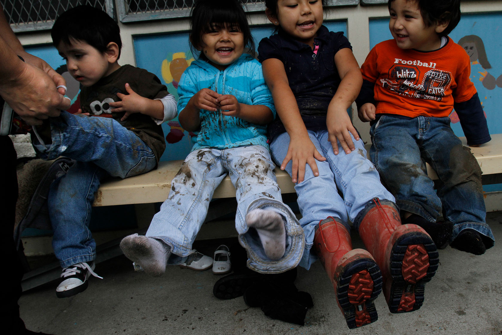 Young children sitting on bench
