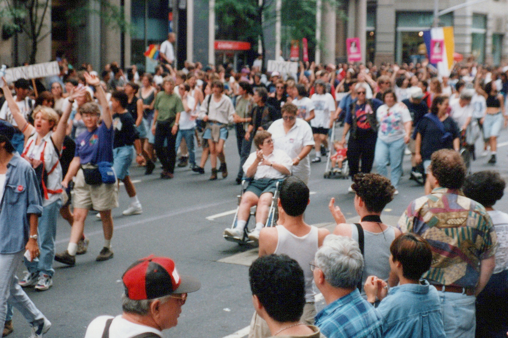 A woman in a wheelchair goes down during NYC Pride March.