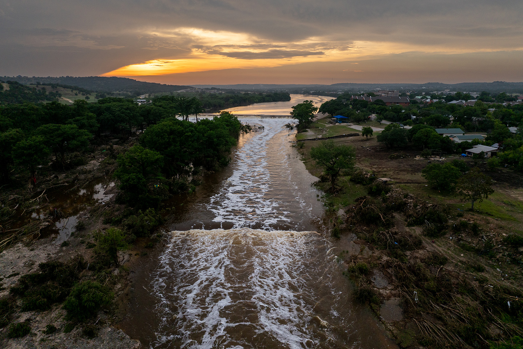 The sun sets over the Guadalupe River.