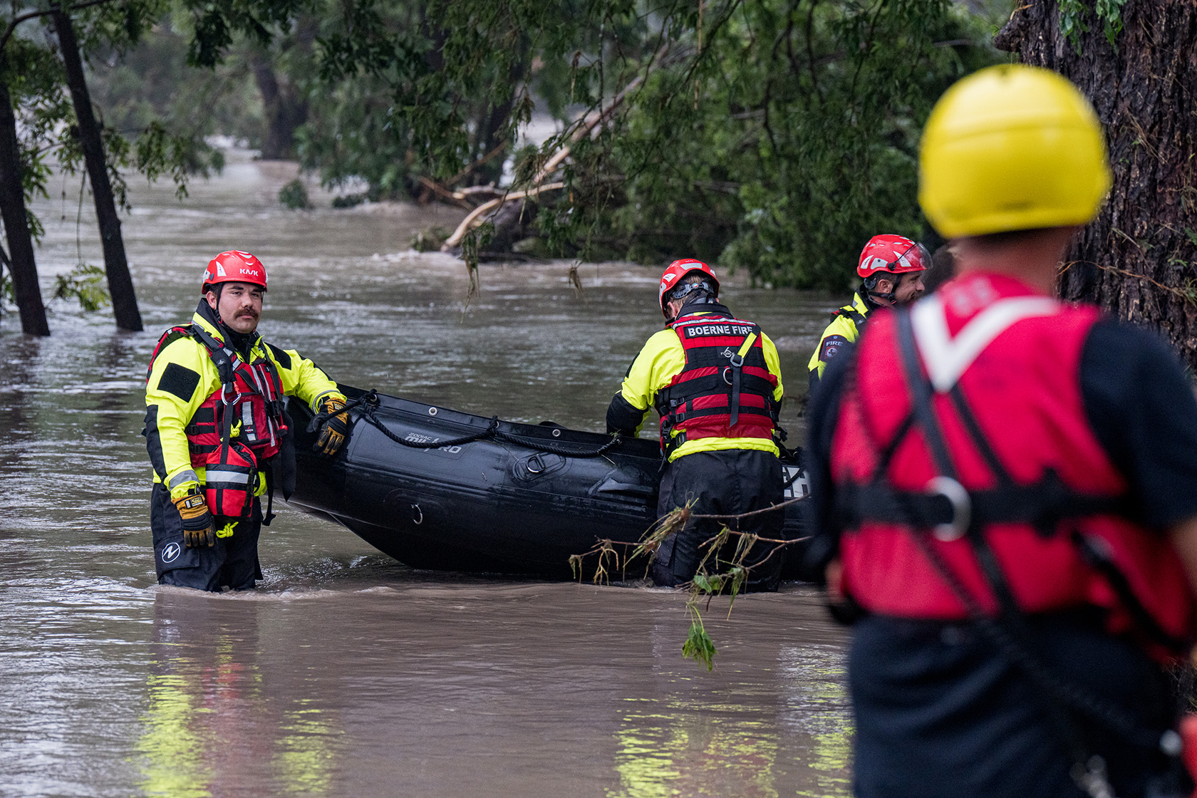Boerne search and rescue team members prepare their Zodiac boat for operations.