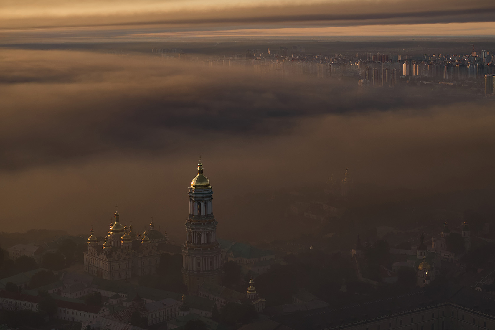 Smoke blankets Kyiv after an overnight drone strike by Russia.