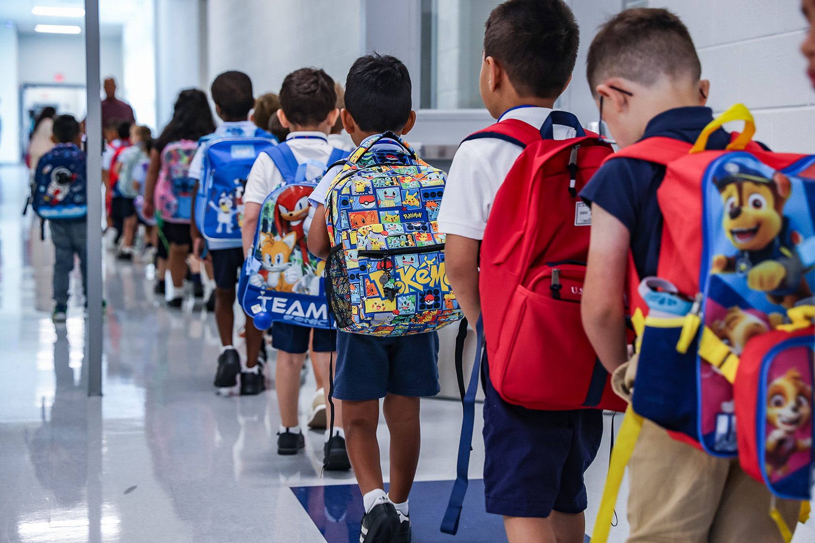 Students line up during their first day back to school.
