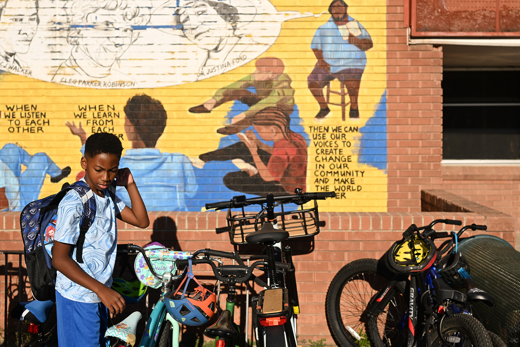 A fifth-grade student locks up his bike before heading in for the first day of the 2025-26 academic year.