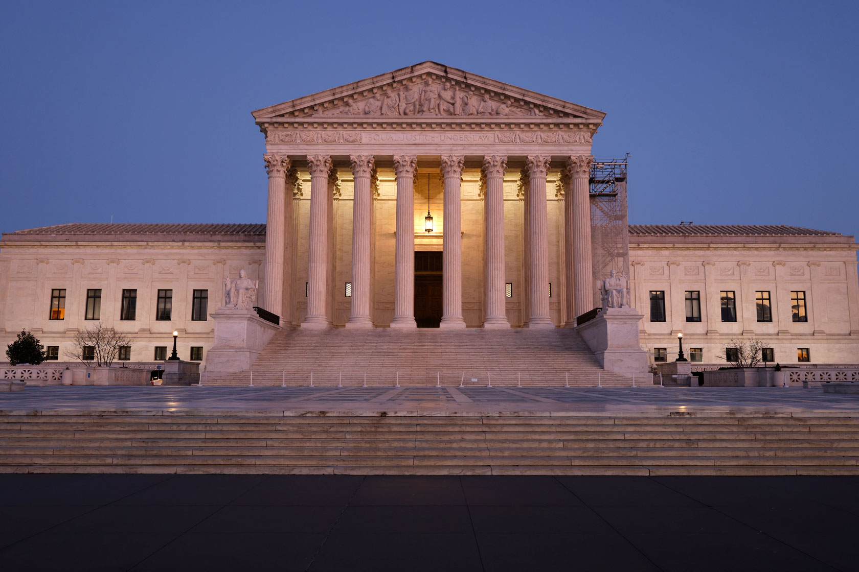 The U.S. Supreme Court building is seen at dusk.