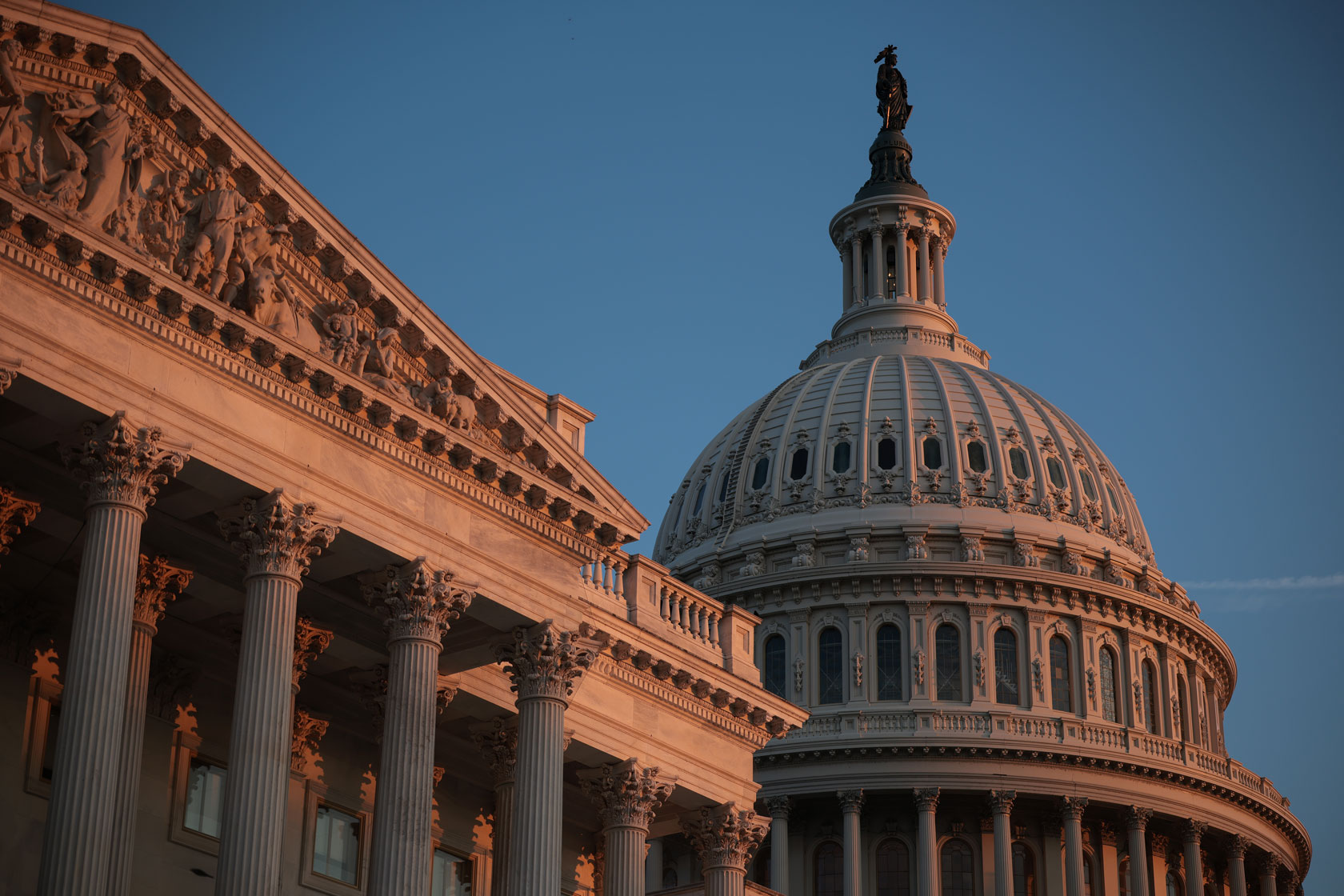 The U.S. Capitol building is seen at sunset.