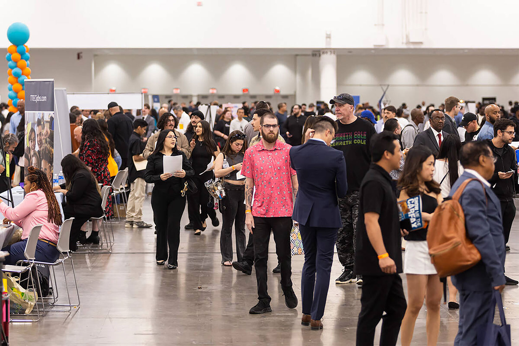People standing in line at job fair