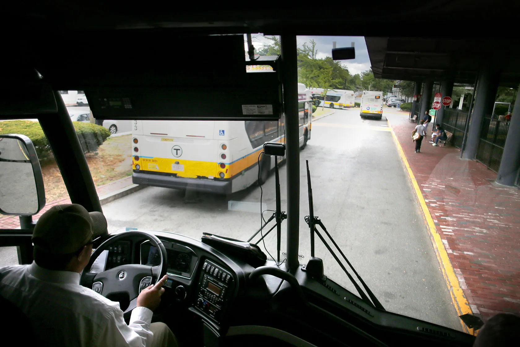 A bus driver steers into the Forest Hills Station in Boston.