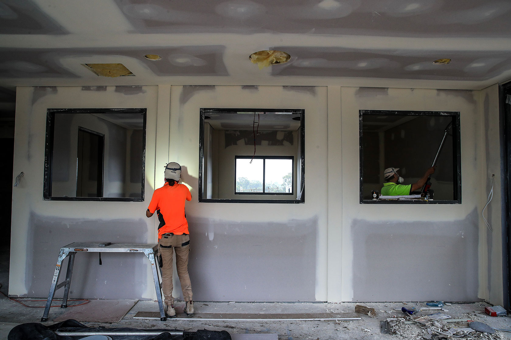 Two workers on a building site