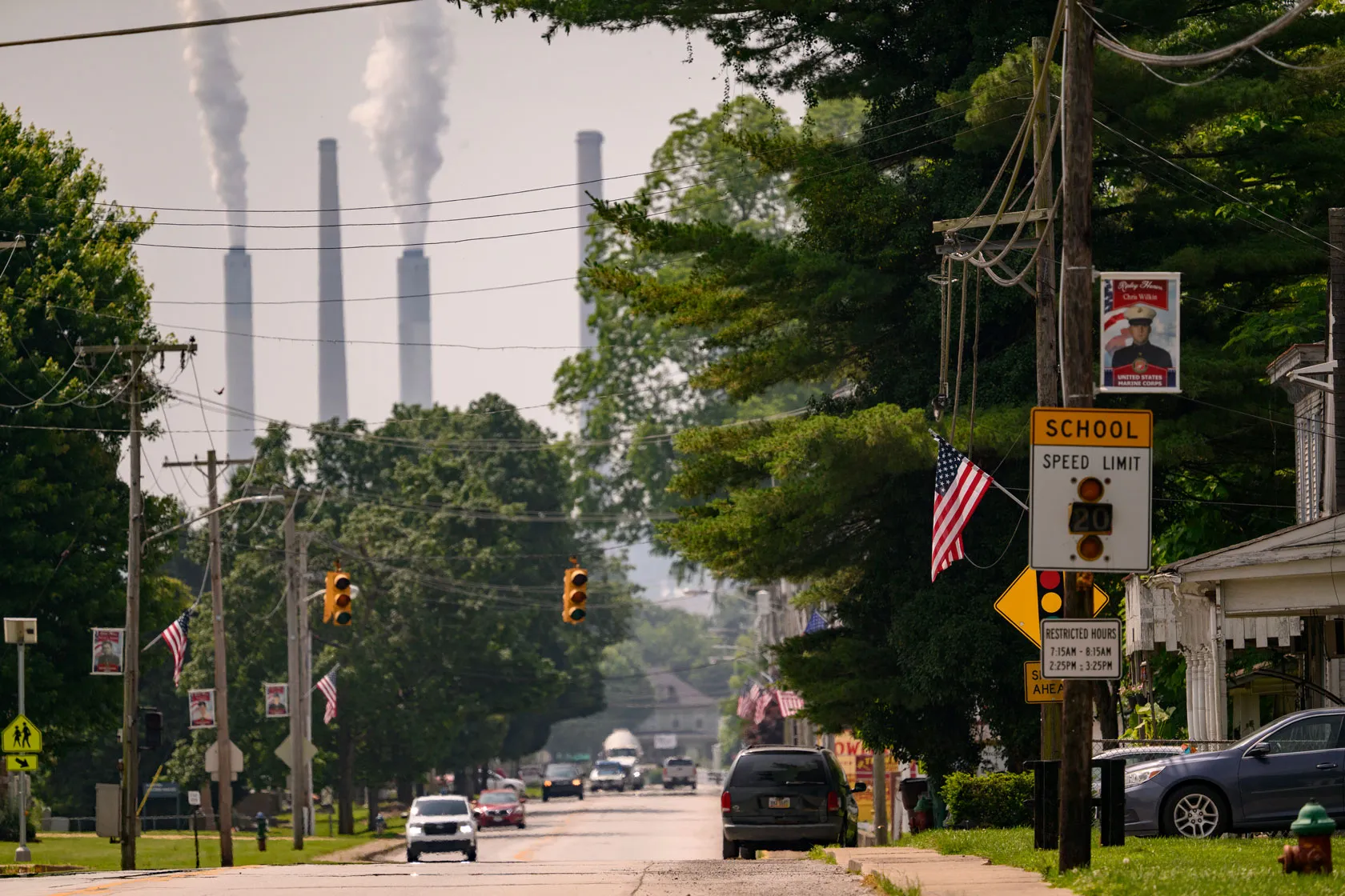 In the background of the view of a residential street, smokestacks at the Hugh L. Spurlock Generating Station are seen in Maysville, Kentucky.