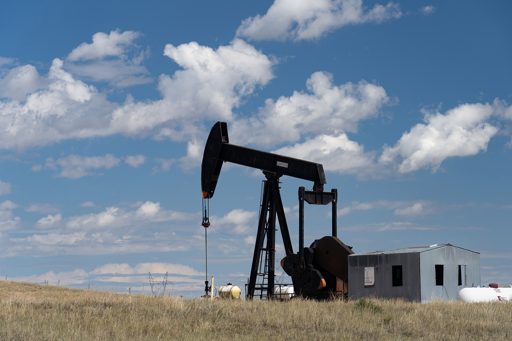An oil pumpjack operates in the Great Plains of southeastern Wyoming.